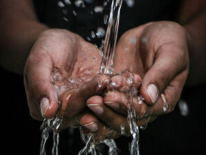 hands catching water
